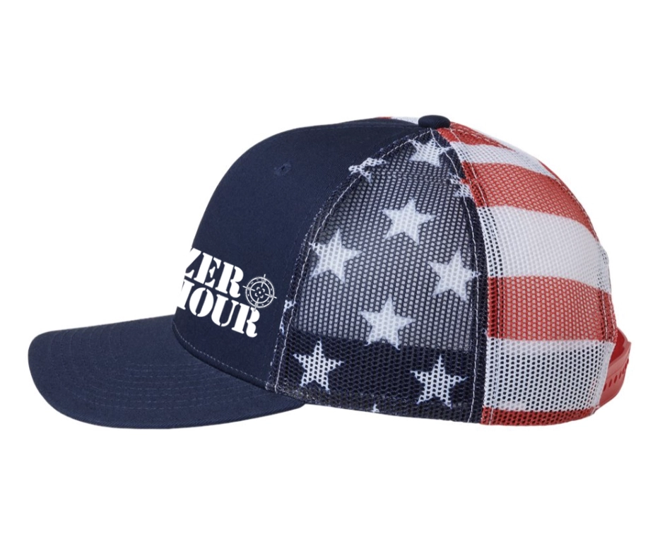 Side profile of the Zero Hour USA Flag Trucker Hat showing the American flag mesh back, navy front panel, curved bill, and adjustable snapback closure.